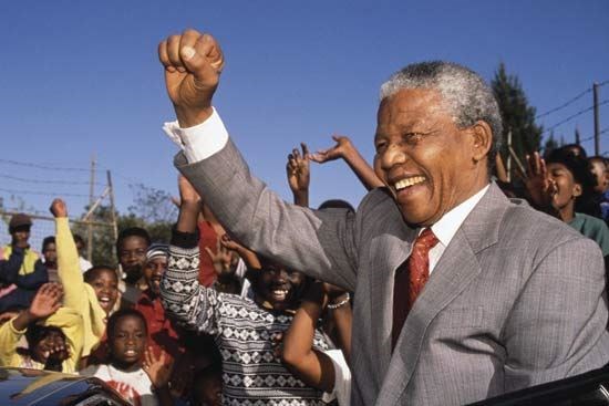 <a href=http://student.britannica.com/comptons/art-92121/Nelson-Mandela-visiting-a-school-in-Johannesburg-SAf?&articleTypeId=1>Mandela visits a school in Johannesburg, 1993</a>