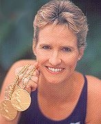 Sandy holding her three gold medals