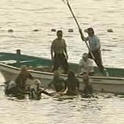 Surfers pushed away by fishermen (i got this picture on sky.com)