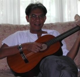 My dad 's playing the guitar.