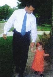 My dad walking with my sister