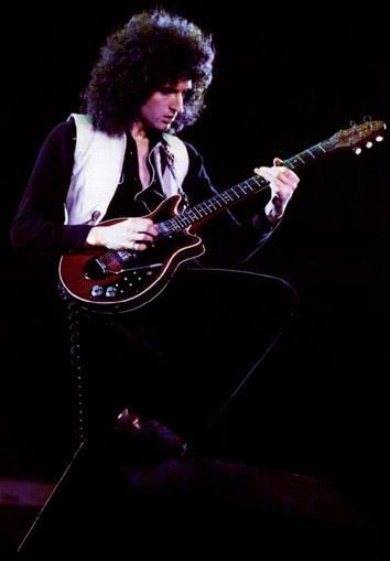 Brian May playing on his guitar, the Red Special