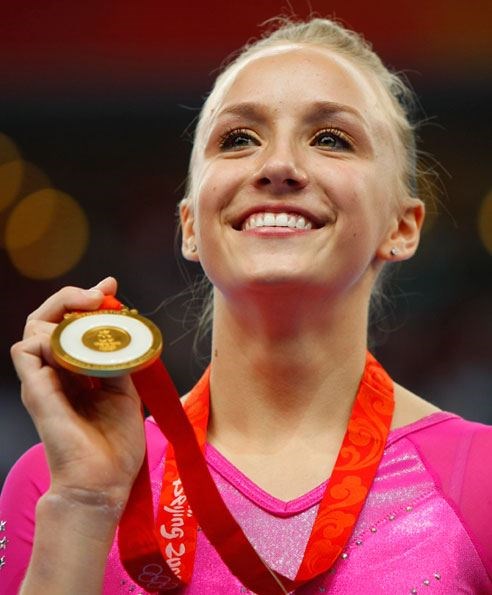 Nastia showin' off her olympic gold medal from th (www.google.com)