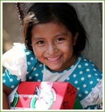 Sweet smile of a child (http://www.willowparkchurch.com/mediafiles/photo-operation-christmas-child.jpg)
