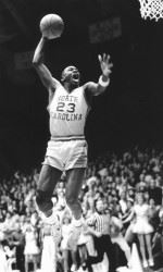 Michael Jordan is taking a basketball shot. (I got it from this website:http://grfx.cstv.com/photos/schools/unc/sports/m-baskbl/auto_action/393087.jpeg. This photographer who took this picture is called Jim Litke.)