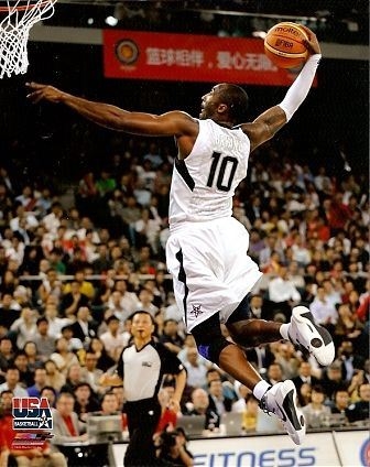 Kobe on his way to a slam dunk at the Olympics in (http://www.sportsmemorabilia.com/files/cache/kobe-bryant-team-usa-2008-olympics-beijing-8x10_4262b8f69d3c7731cd33a19548bb6e2d.jpg )