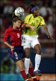 Mia Hamm and a Brazilian defender jump up to head (Picture by Jack Gruber)