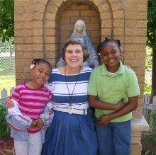 Children having fun with Mary Jo. (cardinal Newman Heritage Project)