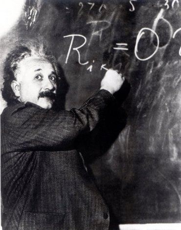 Albert Einstein writing up an equation. (Google Images)
