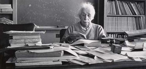 Albert Einstein at his desk. (Google Images)