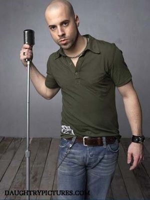 Chris Daughty holding a microphone (http://www.coinflip.com/resources/images/news/chris_daughtry.jpg)