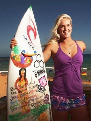 Bethany with her favorite surf board. (http://www.dailytelegraph.com.au/sport/bethanys-story-of-courage/story-e6frexni-1225817912629)