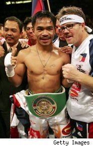 Pacquiao with coach Freddie Roach (http://boxing.fanhouse.com/2008/12/03/freddie-roach-manny-pacquiao-will-beat-oscar-de-la-hoya-because/)