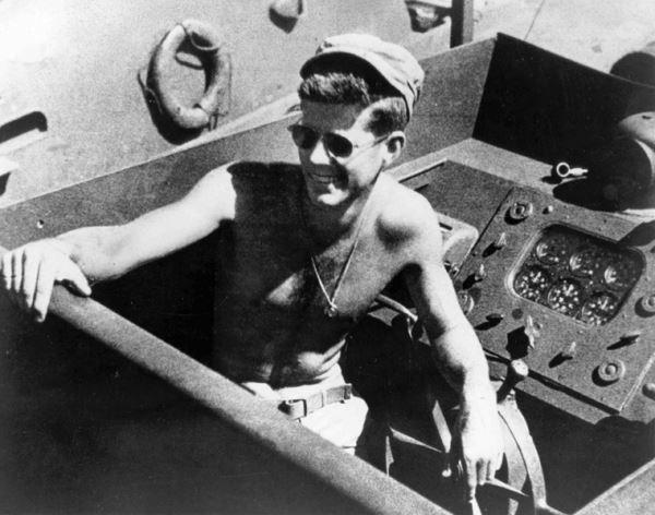 John F. Kennedy at the steering wheel of his PT boat (http://www.shmoop.com/wwii/photo-jfk-ww2.html)