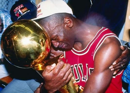 Michael Jordan crying  (http://astartofsomethingnew.files.wordpress.com/2010/09/michael-jordan-first-trophy.jpg?w=535)