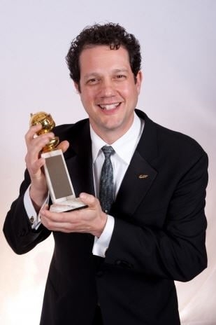 Michael holding his Golden Globe Award. (http://www.musicnacho.com/pics/michael_giacchino_golden_globe_2010.jpg)