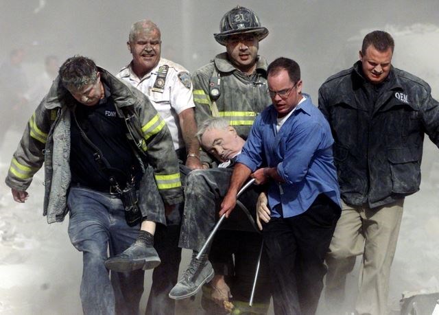 Rescue workers remove Fr. Mychal Judge from the World Trade Center