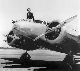 Amelia on her Biplane (http://www.fark.com/comments/3710525/On-this-date-in-1937-Amelia-Earhart-nears-completion-of-her-record-flight-arou)