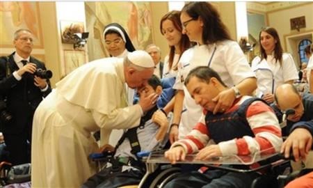 Pope Francis blessing the disabled (www.bbc.com (BBC News))