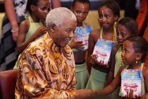 Mandela passing out lunches at a benefit event. (https://www.google.com/url?sa=i&rct=j&q=&esrc=s&so ())