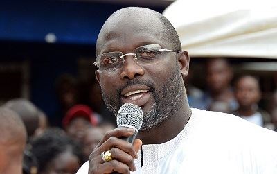 George Weah at a political rally (International Business Times)