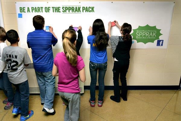 Students at Dixie Bee Elementary School in Terre Haute, Ind., post positive messages about fellow classmates and the school's staff. SPPRAK, a local not-for-profit, unveiled a new program this week that literally 'notes' random acts of kindness by students, teachers, and staff.  <P>Joseph C. Garza/The Tribune-Star/AP