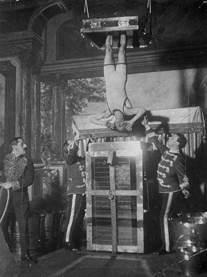 Houdini performing Chinese water torture 