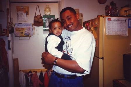 my dad holding me as a baby. (home photagraph)