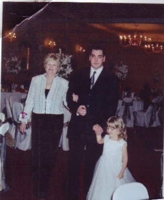 My grandma, dad and sister at my cousin's wedding (personal picture)