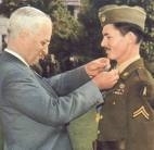 Doss recieving the Medal of Honor award. (http://www.incrediblepeople.com/image/doss+harry%20truman.jpg)