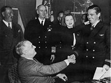 Medal of Honor presentation on April 21, 1942: President Roosevelt, Frank Knox, Secretary of the Navy  (behind FDR), Admiral Ernest King, Edward O'Hare and his wife Rita. (wiki.org)