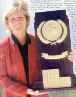 Margie Wright showing off one of her awards. (http://www.csufresno.edu)