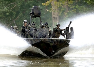 Navy seals in a patrol boat (FlickrStorm.com (An Honorable German))