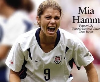 Mia Hamm with her gold medal at the 2004 Olympics (http://goal.blogs.nytimes.com/2011/01/05/lilly-iron-lady-of-u-s-soccer-retires-at-39/ ())