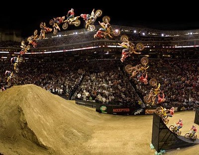 Travis Pastrana performing a double backflip (http://motorcyclesandmotorcycles.blogspot.com/2010/06/travis-pastrana-double-back-flip.html ())