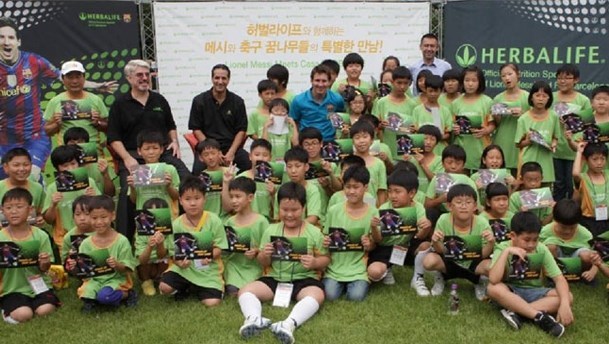 Lionel Messi with children of Herbalife (http://www.fundacionleomessi.org/upload/images/noticias/443_destacada_th.jpg (Leo Messi Foundation))