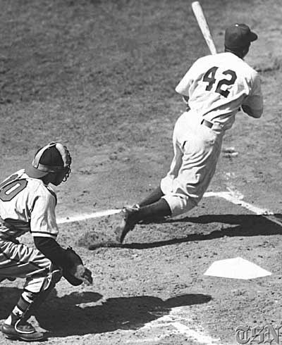 Jackie after taking a swing (http://offthemonster.blogspot.com/2012/04/happy-jackie-robinson-day.html ())