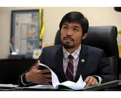 Manny in his office (Google.com)