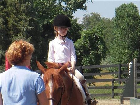 Kathleen is helping her daughter in a horse show