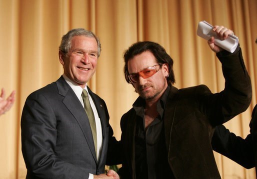 Bono with President George W. Bush  (http://www.google.com/imgres?q=bono+and+george+bus ())