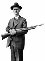 John Browning with one of his many Guns (http://www.gunbanfacts.com/Get_the_Facts/gun_owners_right/slope.aspx)