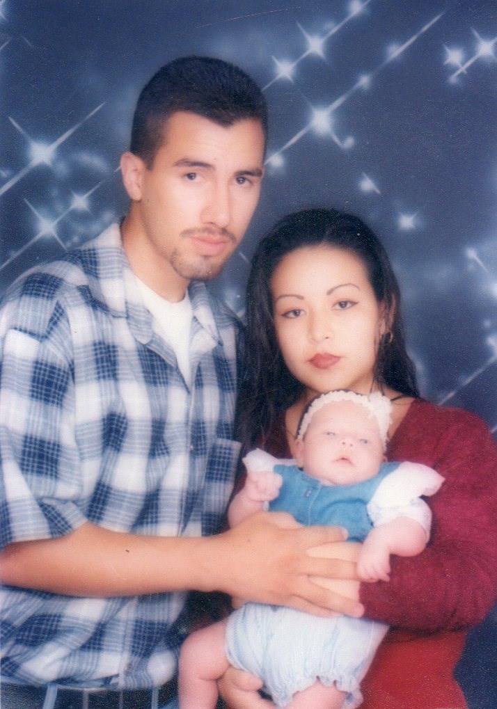 This is my mom,dad and myself (My parents bought this picture a long time ago (Photographers))