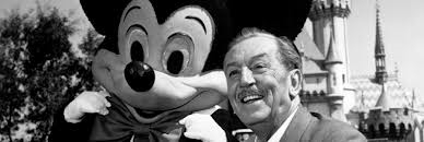 Walt Disney standing with Mickey Mouse in Disney. (Google ())