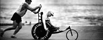 Dick pushing Rick in one of their many races.  (www.verandasuntanning.com ())