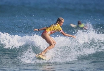  Surfing while still young and with her arm (http://www.surfersvillage.com/sites/default/files/ ())