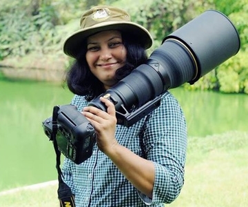 Here is Rathika Ramasamy with her Nikon camera. (http://www.bing.com/images/search?q=Rathika+Ramasa ())