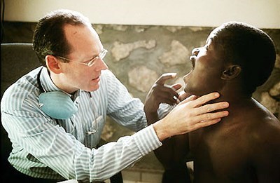 Farmer performing a check-up on a patient (Academy of Achievement)
