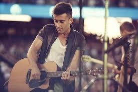 Phil with his guitar (I got this picture off of Google  (www.harvest.org))