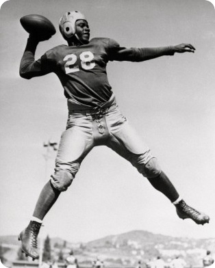 Jackie playing foot ball  (http://www.jackierobinson.ymca.org/lib-local/asset ())