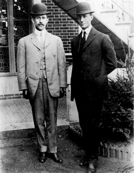 The Wright brothers standing in front of their hou (http://www.flyaoamedia.com/ ())
